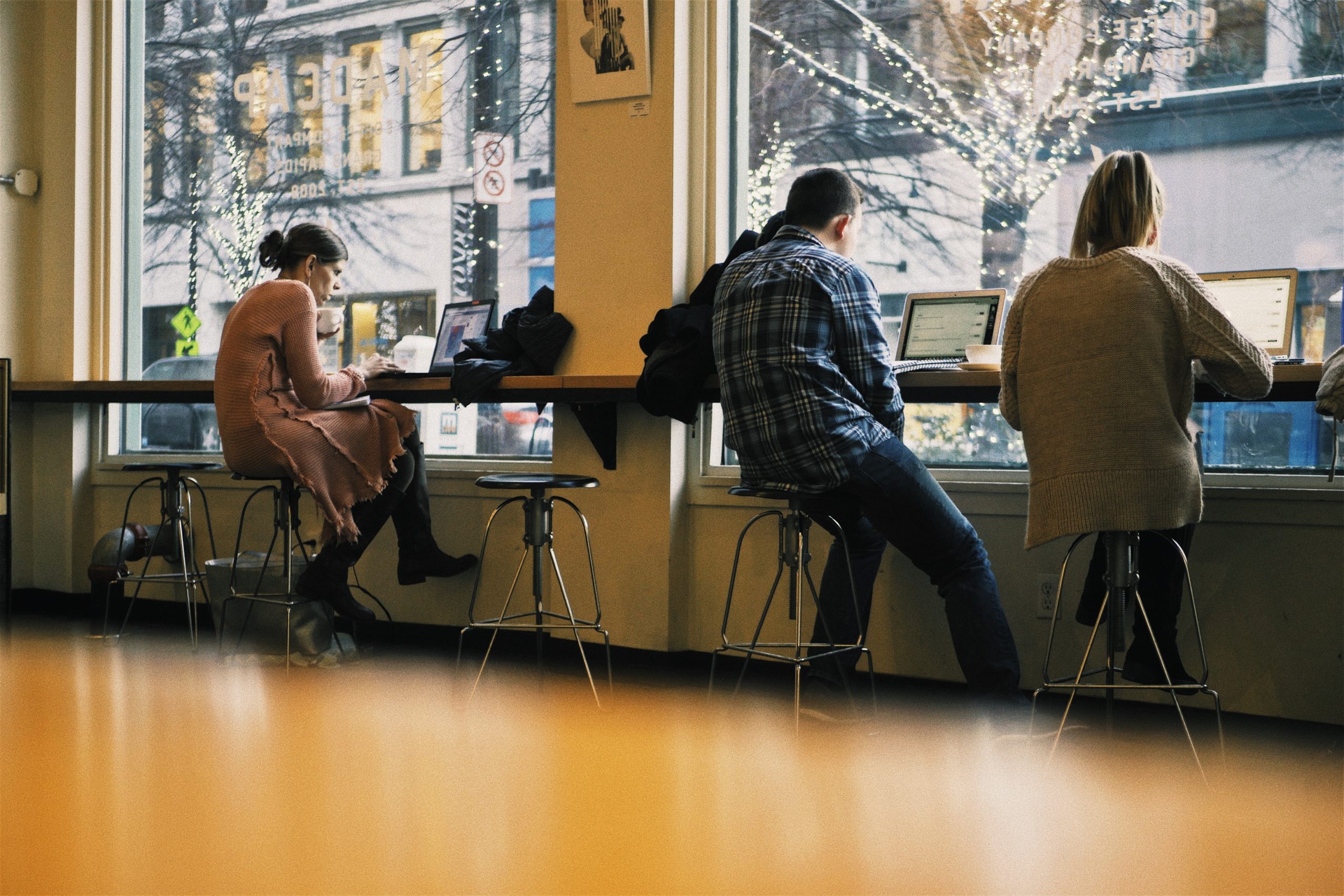 students gather at a coffee shop