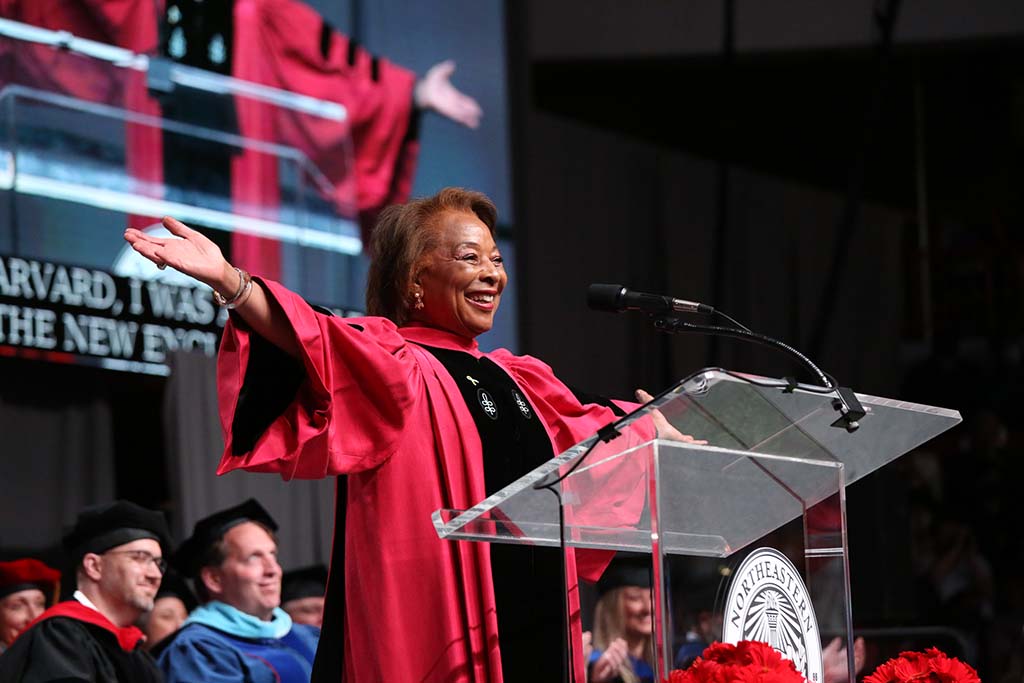 Graduation Speaker Priscilla H. Douglas smiles at the podium during her address at the 2022 May CPS Graduation Ceremony. Photo by Heratch Ekmekijan